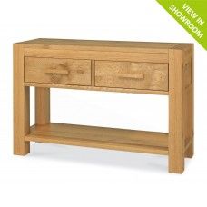 an oak console table with two drawers and one shelf on the bottom, in front of a white background