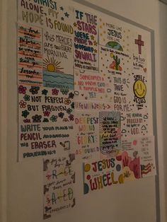 a white wall covered in lots of different types of stickers