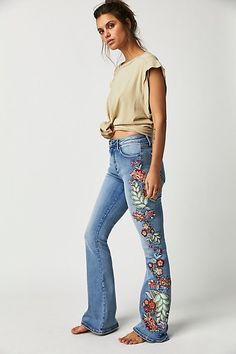 So special in a vintage-inspired design, these classic denim jeans from Driftwood are featured in a high-rise, flare silhouette with exaggerated floral embroidery at sides for added dimension.* Zip-fly and button closure* Five pocket design* Soft, stretch denim Boho Winter Outfits, Boho Jeans, Jeans Free People, All Jeans, Floral Jeans, Boho Chic Outfits, Embroidery Fashion, Costume Outfits, Casual Fall Outfits