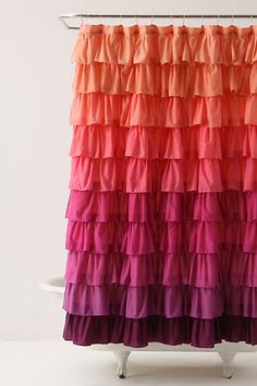 a shower curtain with multicolored ruffles on it