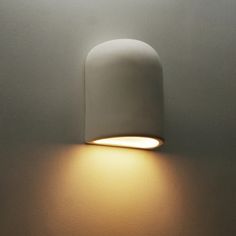 a white light that is on the side of a wall