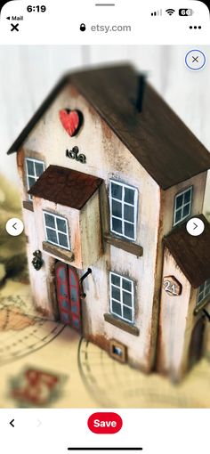 an image of a small house with hearts on it