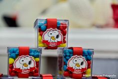 four clear boxes with hello kitty candies in them