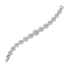 CZ Wedding Bracelet b4542 This glistening bridal bracelet features a rhodium silver plated design with graduating sizes of sparkling CZ crystals. Designed for smaller wrists, this bracelet will be add lots of bling to your wedding ensemble, Size: Decorated portion is 6" long and 0.5" wide at widest point. Color: Silver/Clear. Style: b4542. Please allow 1 week for delivery. Shipping Policy . Return Policy. Wedding Cubic Zirconia Diamond Bracelet With Handset Stones, Wedding Diamond Bracelet With Handset Cubic Zirconia Stones, Wedding Crystal Tennis Bracelet With Brilliant Cut, Wedding Crystal Tennis Bracelet Sparkling, Sterling Silver Bracelet With Sparkling Stones For Wedding, Classic Sparkling Diamond Bracelet For Wedding, Crystal Sparkling Tennis Bracelet For Wedding, Sparkling Crystal Tennis Bracelet For Weddings, Wedding Sparkling Crystal Tennis Bracelet