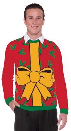 a man wearing an ugly christmas sweater with a bow on it