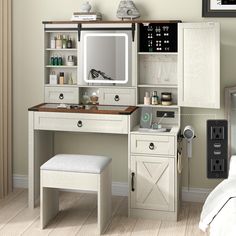 a bedroom with a vanity, stool and mirror