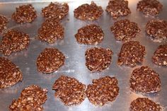 some cookies are sitting on a cookie sheet and ready to be baked in the oven