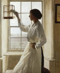 a painting of a woman holding a birdcage in her right hand and looking out the window