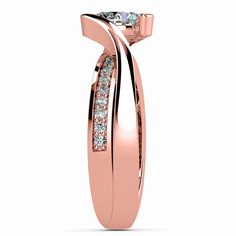 a rose gold ring with diamonds on it