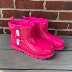 A Clear Upper With A Bold Logo Will Keep Your Feet Dry In These Fun Boots By Ugg. Features Waterproof Protection, 1 1/4" Heel, 5 1/2" Shaft, Pull-On Style, Removable Insole, Synthetic Upper, 100% Polyester Faux Fur Upper Lining, Uggpure Wool Insole, Synthetic Sole. Excellent New Condition, With Very Minor Marks/Dirt Throughout From Store Handling And No Wear To Soles Or Matting To Insoles. In Fun Pink!! Size 6. Pink Rain Boots For Winter Outdoor Use, Pink Rain Boots For Winter Outdoor Activities, Pink Winter Rain Boots For Outdoor, Winter Outdoor Pink Rain Boots, Pink Weatherproof Winter Boots, Sporty Waterproof Pink Boots, Sporty Pink Waterproof Boots, Winter Pink Waterproof Boots, Pink Waterproof Winter Boots With Round Toe