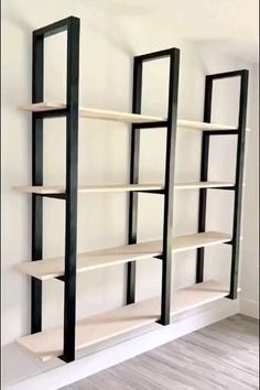 an empty book shelf in the corner of a room