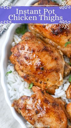 two pieces of chicken on a white plate with lemons and green beans next to it