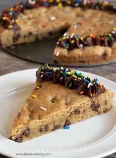 a slice of chocolate chip cookie pie with sprinkles on a white plate