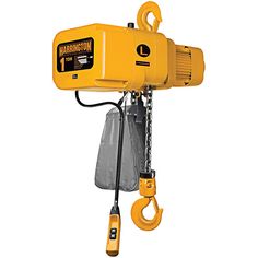 a yellow hoist is hanging from the ceiling