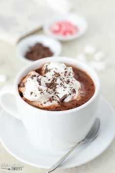 a cup of hot chocolate with whipped cream on top