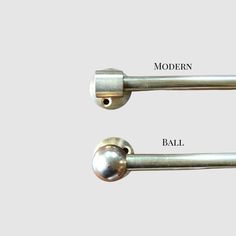 two metal handles with the names modern and ball