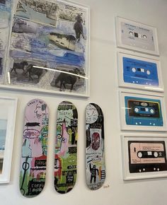 there are several different types of skateboards on the wall