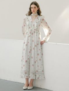 Calf-length, floral chiffon dress. V-shaped neckline, flounce-trimmed, fitted bodice and gently flared skirt. Long balloon sleeves with narrow elastic at cuffs and a lace scarf. Partly lined. - Midi- V-neck- Long sleeves Feminine Spring Dress With Lace Cuffs, Spring Chiffon Maxi Dress With Lace Trim, Spring Midi Dress With Lace Cuffs, Feminine Chiffon Midi Dress For Daywear, Elegant Long Sleeve Floral Dress For Daywear, Elegant Chiffon Dress With Ruffle Hem For Garden Party, Feminine Spring Dress With Lace Collar, Chiffon Dress With Lace Trim For Garden Party, Chiffon Lace Trim Dress For Garden Party