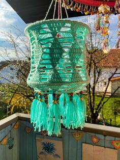 a green chandelier hanging from the ceiling