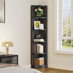 a bedroom with a bed, window and book shelf