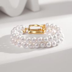 Introducing our exquisite Double Layer Pearl Bracelet, a perfect fusion of elegance and charm. This bracelet showcases two layers of lustrous freshwater pearls, delicately crafted to enhance your wrist with grace and sophistication. The combination of the glowing pearls and the 925 silver gold-plated clasp adds a touch of luxury to this stunning piece. Versatile and timeless, this bracelet effortlessly complements any outfit, from casual to formal, making it a must-have accessory for any occasio Ladies Rings, Luxury Bracelet, Gold Armband, Stylish Bracelet, Freshwater Pearl Bracelet, Wedding Jewelry Bracelets, Color Vintage, Bar Bracelets, Water Pearls