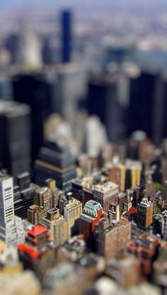 an aerial view of a city with tall buildings and skyscrapers in the foreground