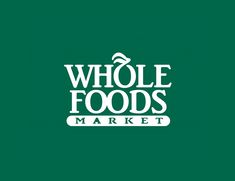 the whole foods market logo on a green background