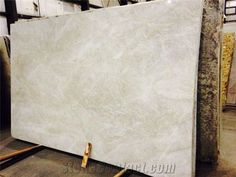 a large white marble slab in a warehouse