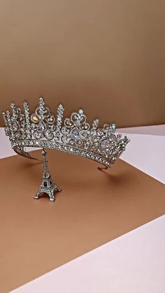 BELLEZA MAJESTC is one of our most luxurious Crowns with Stunning Design. It is a Majestic Swarovski Crown that is timeless and classic to complete any special look. The design is made up of tear drop and round crystals with a swirl design to give it the an outstanding look. It is a royal statement piece fit for a queen on her wedding day. Available as Regular Crown ( 3/4 crown) and Full Crown (full circle crown). Loops on the inside of the full crown for stability and security. ( bobby-pins use Full Circle Crown, Rose Gold Tiara, Bridal Hair Combs Pearl, Royal Crowns, Bridal Store, Pearl Headpiece, Crown Earrings, Gold Headpiece, Beautiful Tiaras