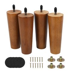 three wooden poles with screws and nails in them next to some woodworking tools