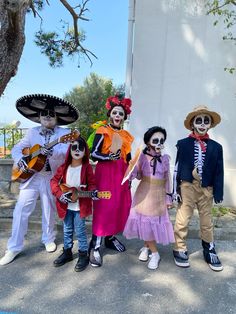 a group of people in costumes standing next to each other