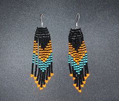 Beaded fringe earrings Orange Fringe Dangle Earrings, Orange Tassel Jewelry With Round Beads, Orange Beaded Fringe Earrings With Round Beads, Orange Beaded Fringe Drop Earrings, Orange Beaded Fringe Jewelry, Orange Beaded Fringe Dangle Earrings, Orange Tassel Dangle Earrings, Orange Fringe Beaded Earrings As Gift, Orange Beaded Fringe Earrings As Gift