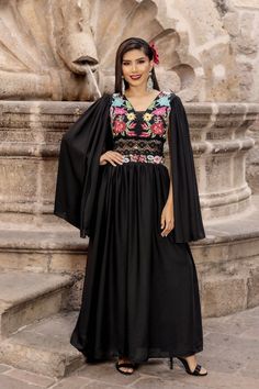 Step into elegance with our enchanting Mexican embroidered dress crafted from delicate chiffon, exquisitely adorned with intricate traditional embroidery.  Elevate your style with removable long flow sleeves, offering versatility and sophistication for any occasion. There is elastic on the back for a comfortable yet adjustable fit.  This gorgeous dress is a Solei exclusive design. More styles available here: https://www.etsy.com/your/shops/SoleiEthnic/tools/listings/section:25367133 Formal Mexican Dress, Traditional Maxi Length Embroidered Dress, Traditional Embroidered Maxi Dress With Embroidered Neckline, Intricate Embroidery Maxi Dress For Traditional Ceremonies, Elegant Georgette Dresses For Traditional Ceremonies, Bohemian Maxi Dress With Floral Embroidery For Party, Embroidered Maxi Dress For Traditional Ceremonies, Folk Style Wedding Dress For Eid, Folk Style Embroidered Floor-length Dress