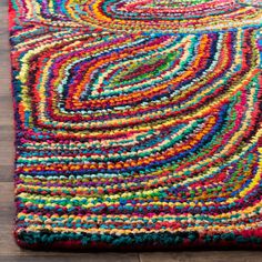 a multicolored area rug on the floor