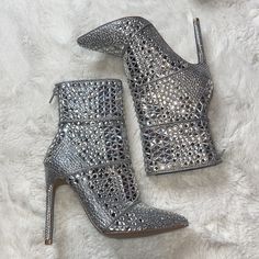 Tried On Once Other Than That Brand New - Steve Madden Crossing Rhinestone Booties - Size: 6 - A Myriad Of Rhinestones Lends Mirror Metallic Shine To The Chic Pointed-Toe Profile Of Steve Madden's Crossing Booties 4-1/2" Heel Pointed-Toe Booties With Back Zipper Closure Allover Rhinestone Detailing Fabric Upper; Manmade Lining; Manmade Sole Glamorous Embellished Wedding Boots, Glamorous Embellished Ankle Boot Heels, Elegant Rhinestone Ankle Boots, Rhinestone Ankle Boot Heels For Party, Elegant Rhinestone Ankle Boot Heels, Sparkling Round Toe Wedding Boots, Glamorous Round Toe Wedding Boots, Silver Embellished Wedding Boots, Embellished Silver Wedding Boots