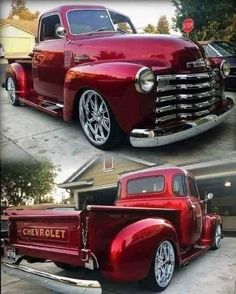 an old red truck parked in front of a house