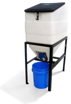 a white and blue cooler sitting on top of a black stand next to a blue bucket