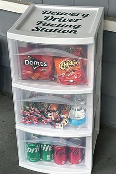 three bins stacked on top of each other with drinks and soda cans in them