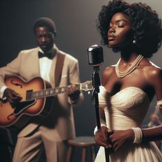 a woman in a white dress standing next to a man holding a guitar and singing into a microphone