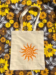 boho sun handmade tote bag <3 🌸FREE UK SHIPPING (2nd class) 🌸100% cotton tote bag 🌸handmade and printed in the uk  🌸heat pressed for durability  🌸5oz tote bag  🌸dimensions - 42cm x 38 cm (classic tote size) Paintings On Bags, Drawing On Bags Ideas, Eco Bag Aesthetic, Cute Tote Bag Ideas, Painted Bags Ideas, Painting On Tote Bags, Ecobag Design Ideas, Tote Bag Painting Ideas Aesthetic