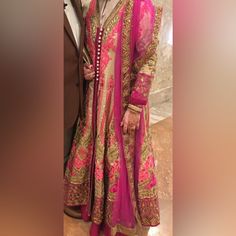 This Beautiful Dress Was Only Worn Once. It Is Heavily Embroidered And Filled With Intricate Bead Work. Get Ready For All The Compliments When You Wear It. It Is Defiantly A Show Stopper. Chest 44, Waist 36, Hips 40, Sleeves 20 But Definitely More Room To Go Up More. Long Pink Wedding Dress, Pink Dresses With Resham Embroidery In Traditional Drape, Pink Dress With Resham Embroidery And Traditional Drape, Pink Formal Anarkali Dresses, Formal Pink Dress With Resham Embroidery, Pink Formal Dress With Resham Embroidery, Traditional Fitted Pink Dress, Fitted Traditional Pink Dress, Pink Fitted Dress For Designer Wear