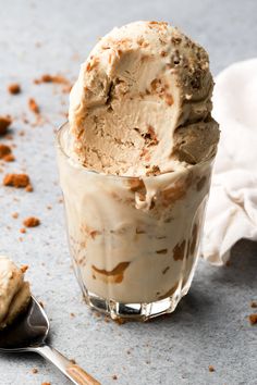 an ice cream sundae in a glass with a spoon