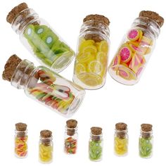 several glass jars filled with different types of candies