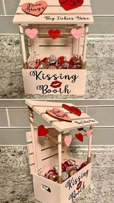 two wooden boxes with hearts on them and the words kissing booth in red, white and pink