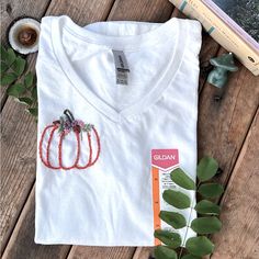 I Embroidered This Little Pumpkin To Be Worn Comfortably In The Fall! :) It’s A Super Cute And A Simple Design. I Love Anything Pumpkin Themed. Message Me For Any Questions. Thank You! Cotton V-neck T-shirt With Floral Embroidery, V-neck Cotton T-shirt With Floral Embroidery, Floral Embroidered Cotton V-neck T-shirt, Fall Cotton T-shirt With Floral Embroidery, Embroidered Pumpkin, Pumpkin Embroidery, Linen Tee, Beach T Shirts, Blue Tee