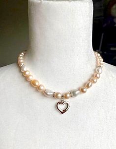 Pearl beaded necklace, Heart charm necklace, Single strand pearl necklace, Bridesmaid Necklace, Wedding necklace, Rose Gold Pearl Necklace ❤Materials; -10-12 mm blush pink, peach, rose gold and white baroque pearl  beads -8 mm potato shape peach color pearls  -7mm crystal spacers  -1 inch long silver pewter heart charm Pearl is said to symbolize the purity, generosity, integrity, and loyalty of its wearer.  ❤Ideal for; - Bridal shower gift - Bridesmaid  - Pearl lovers - Blush Wedding necklace - Beaded Pearl Necklace For Valentine's Day, Silver Pearl Necklace For Valentine's Day, Delicate Pearl Necklace With Heart Charm, Pearl White Necklaces With Heart Charm, Pink Heart Beads Necklace For Wedding, Valentine's Day Pearl Necklaces With Round Beads, Pearl White Necklace With Heart Charm, Valentine's Day Silver Pearl Necklace With Heart Beads, Pearl Beaded Necklaces With Heart Pendant