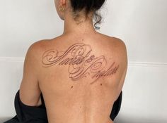 a woman with a tattoo on her back