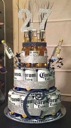 a cake made out of beer bottles and silver glitters is shown on the phone