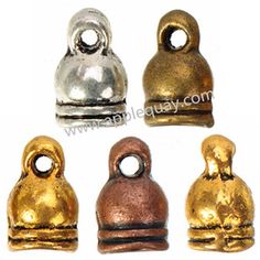 four different types of gold and silver metal beads