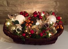 a basket filled with ornaments and lights on top of a table